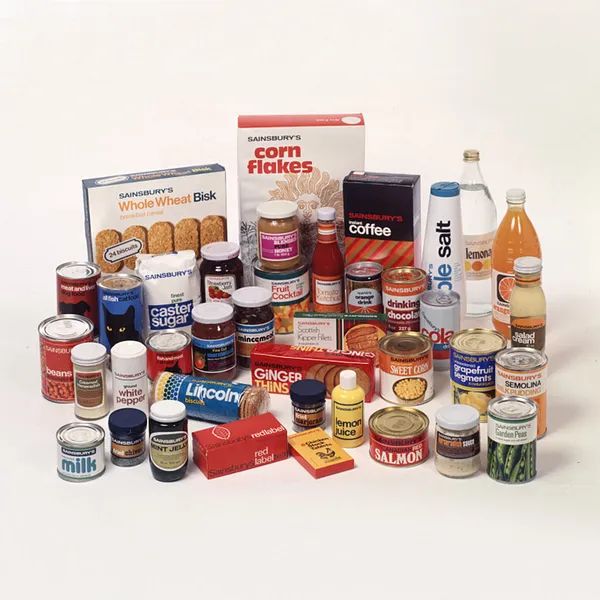 A collection of packaged foods including canned vegetables, cereals, sauces, and baking ingredients.