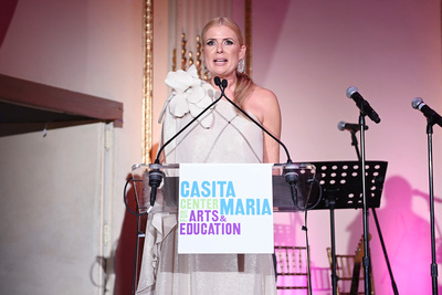 Sissi Fleitas speaks at a podium during a Casita Maria Center for Arts & Education event.