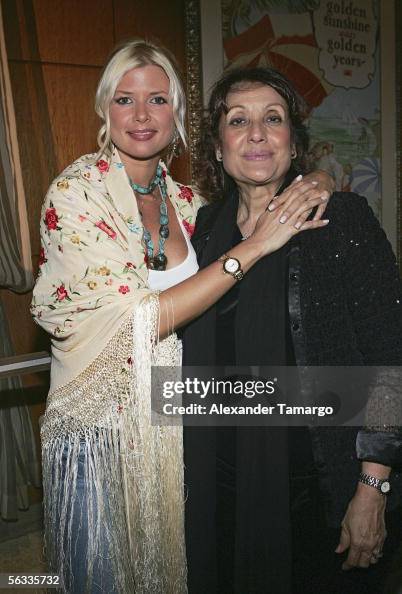 Sissi Fleitas stands beside her mother, Dinorah Arguelles, both smiling at an event celebrating Cuban arts and culture.